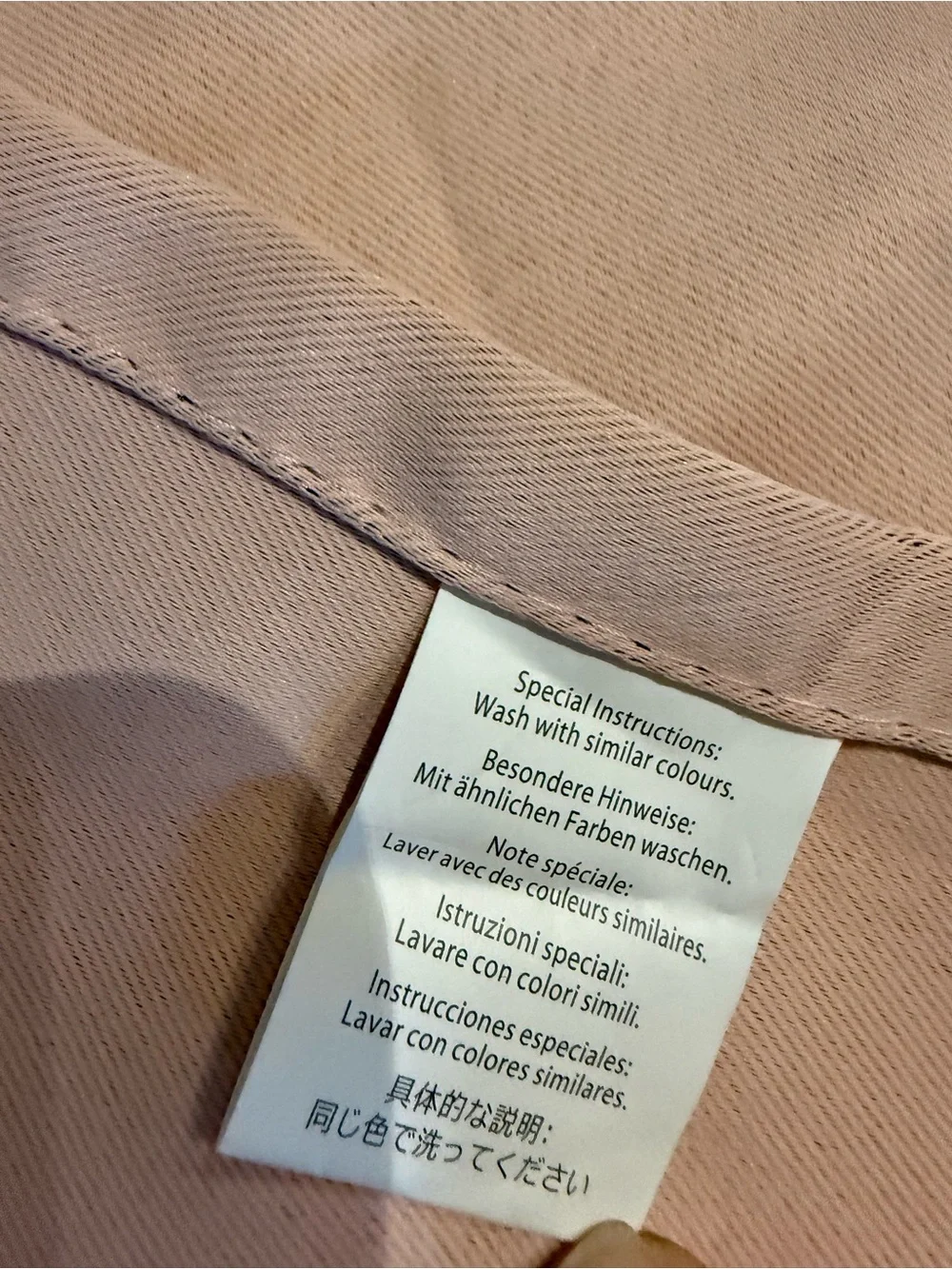 Light pink curtains (2 panels) with ties. Silver grommets.
